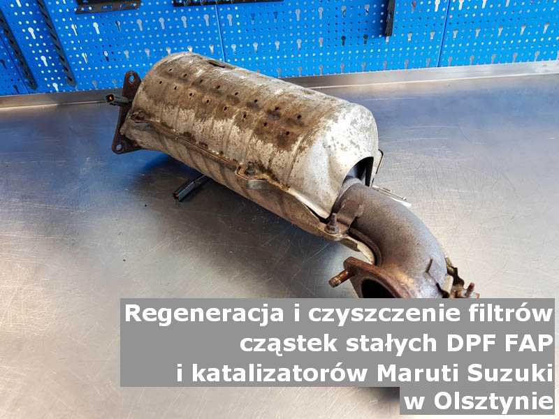 Wypalony z sadzy filtr cząstek stałych DPF/FAP marki Maruti Suzuki, w warsztatowym laboratorium, w Olsztynie.